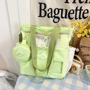 Light green large bucket bag with small round pouch shown in a cozy lifestyle setting