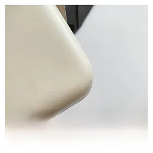 Close-up of premium cream faux leather texture and refined stitching details on the bag