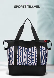 Detail of blue and black patchwork sports travel bag with white letter prints