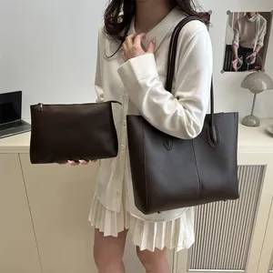 Minimalist dark brown leather tote and pouch set for office and daily commute usage