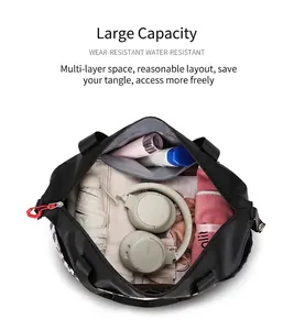 Detailed interior of large black travel tote showing organized compartments and high capacity