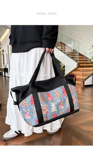 Woman carrying large patchwork travel tote bag with colorful bunny print on stairs