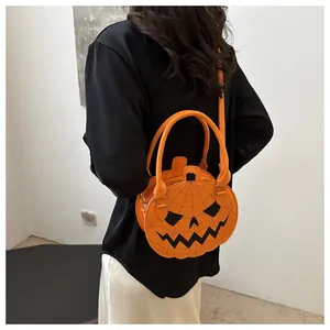 Detail of pumpkin crossbody bag with spider web texture on a model's back
