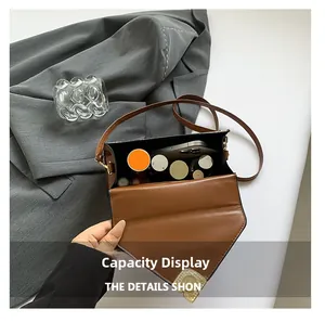 Brown leather crossbody bag interior showing storage space for phone and makeup