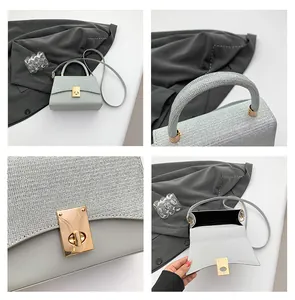 Detail of light blue crossbody bag with silver glitter flap and gold twist lock