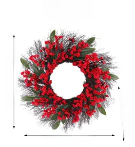Close-up of artificial Christmas wreath with red berries and 50cm diameter dimensions