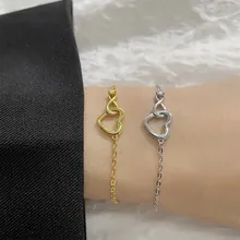 Detail of interlocking hearts and infinity bracelet with sparkling crystals on wrist