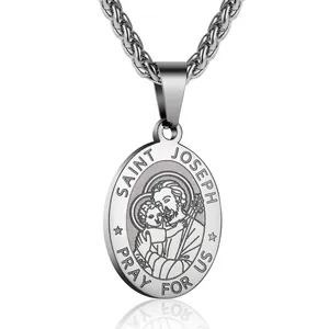 Macro detail of silver Saint Joseph relief on stainless steel oval religious pendant