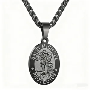 Macro detail of dark grey Saint Michael stainless steel pendant on a wheat chain