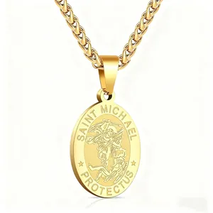 Detail of gold Saint Michael archangel pendant necklace with embossed engraving