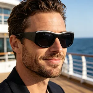 Close-up of black wide temple sunglasses with silver metal bar accents and dark lenses