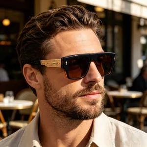 Detailed side profile of stylish square sunglasses featuring ornate gold engraved temples