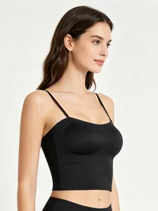 Detail view of seamless black camisole bra with thin straps and integrated chest pads