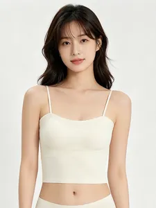 Detail of seamless cream-white padded camisole with thin straps and elastic fabric