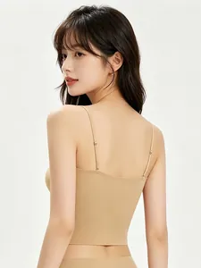 Detail showing seamless back design and adjustable thin straps of the beige camisole