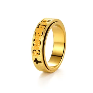 Close-up of a 6mm gold plated titanium steel spinner ring with a cross and Chinese mantra