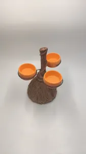 Macro shot of Halloween pumpkin bowl stand featuring broomstick design with three orange trays