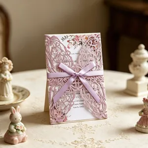Laser cut purple butterfly wedding invitation with floral card and ribbon