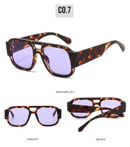 Detailed views of leopard print sunglasses with purple lenses and double-bridge frame