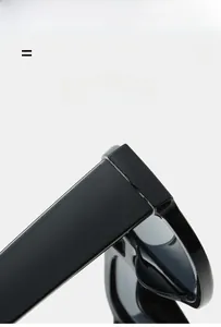 Detail of durable hinges on black oversized sunglasses featuring elastic material