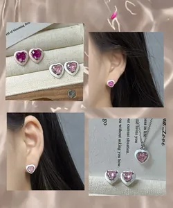 Detail of S925 silver heart stud earrings with pink enamel and sparkling zircon stone