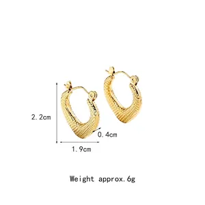 Golden U-shaped textured steel earrings measuring 2.2cm height and 1.9cm width