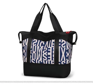 Detail view of large capacity travel tote bag with contrast colors and functional bottom shoe pocket