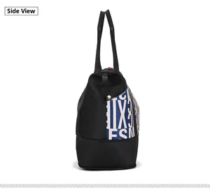 Side view of large nylon tote bag with artistic letter print and durable shoulder handles