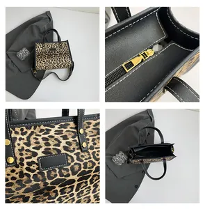 Detalle de bolso tote de leopardo con costuras blancas y herrajes dorados