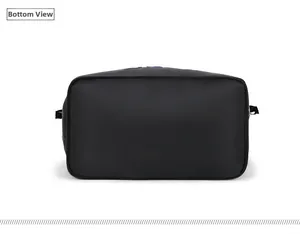 Detailed bottom view of large capacity black nylon tote bag showing wide flat base
