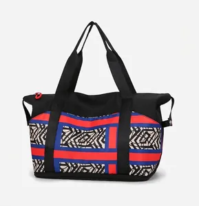 Side view of large capacity tote bag featuring bold geometric patterns and wide handles