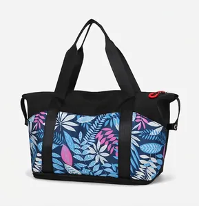 Detail of multi-color tropical leaf print stitching and reinforced metal rivets on travel tote