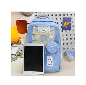 Detail view of the spacious blue and beige backpack with a matching star pouch and tablet