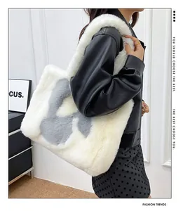 Detail of soft faux fur tote bag with plush texture and stylish letter pattern