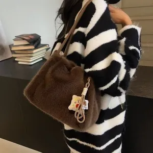 Furry dark brown plush tote bag for winter fashion with cute toast charm pendant