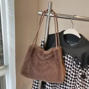 Chic brown plush tote bag made of faux fur with thin shoulder straps for winter style