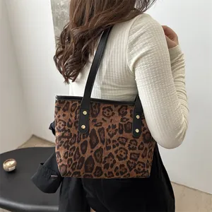 Fashionable leopard print tote bag for women with black leather straps and gold rivets