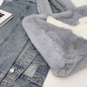 Close-up of grey plush tote bag featuring soft faux fur texture and white swoosh pattern