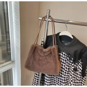 Detail of plush coffee brown faux mink tote bag with slim faux leather shoulder straps