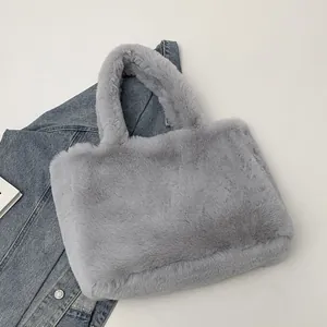 Close-up of light grey plush tote bag made from high-quality dense faux fur material