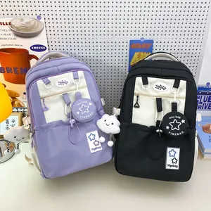 Minimalist high-capacity student backpack in purple and black with plush cloud charms