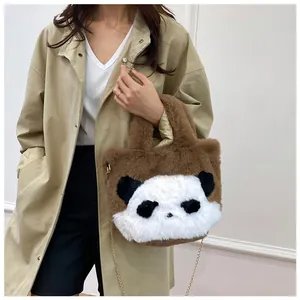 Close-up of plush panda crossbody bag with soft faux fur texture and metal chain