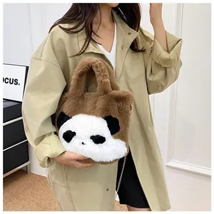 Detail of panda plush crossbody bag with soft faux fur and elegant gold chain strap