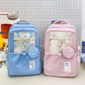 Light blue and pink high-capacity student backpacks with multi-pocket design and cute accessories