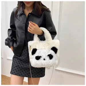 Detail of cute panda plush bag with soft faux fur texture and elegant gold chain strap