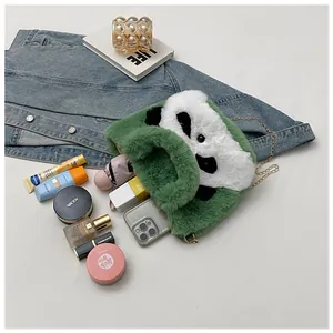 Detail showing plush panda shoulder bag capacity with phone, makeup, and gold chain strap
