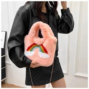 Plush pink handbag featuring a colorful rainbow and cloud pattern with a metal chain strap