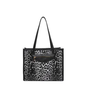 Leopard print tote bag for women with black leather front pocket and double handles