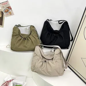 Three colors of lightweight nylon ruched dumpling shoulder bags with adjustable straps