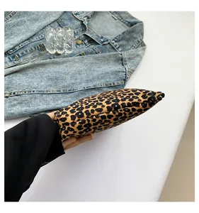 Detail view of the leopard print cosmetic bag with secure zipper and canvas texture